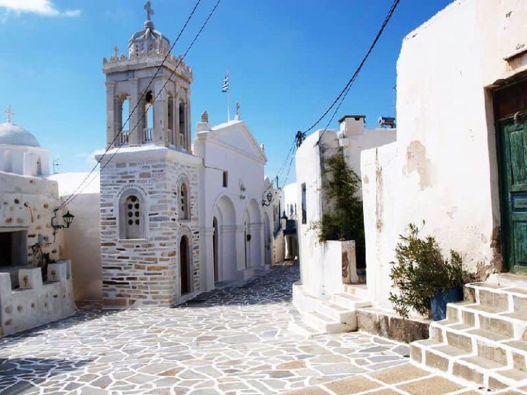Traditional square in Marpissa village Paros with Cycladic church and white houses