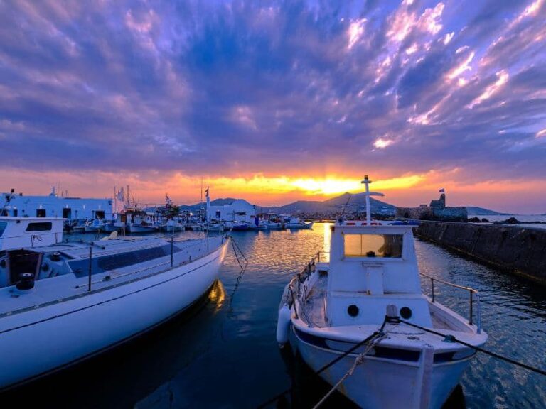 Small harbor in Aliki Paros with boats and evening sky
