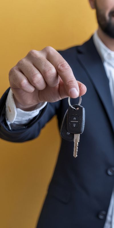 Car rental keys handed to customer for easy vehicle pickup in Paros