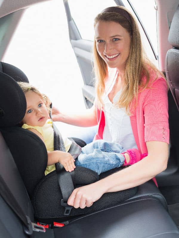 Child safety seat installed in a rental car in Paros for safe family travel