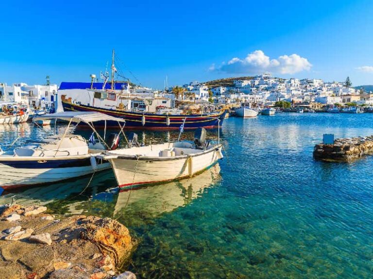 Naoussa harbor in Paros with fishing boats and traditional white houses