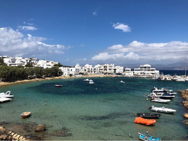 Beautiful harbor in Piso Livadi Paros with boats and beach